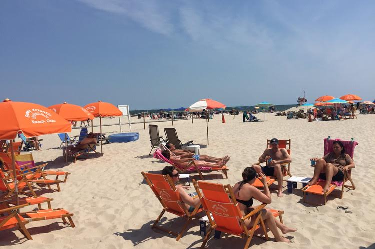 Sunbathers at Sunny Atlantic Beach Club in Atlantic Beach, N.Y. PHOTO: MICHAEL KAPLAN